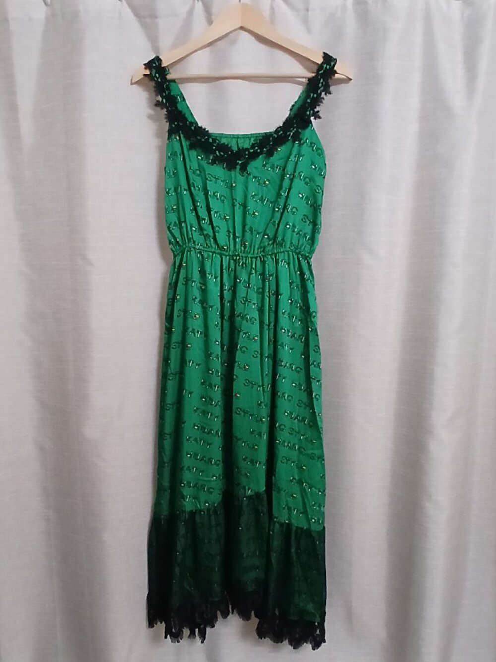 a Long green lace dress